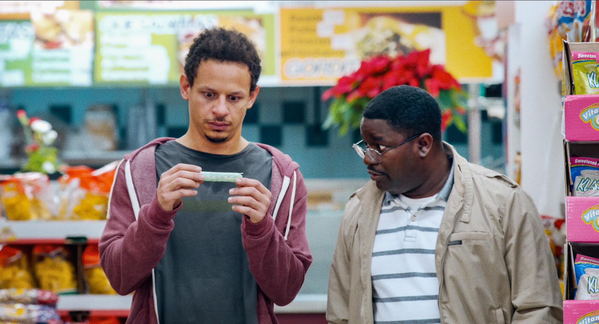 Eric Andre and Lil Rel Howery in a store