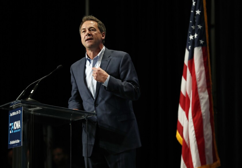 Montana Gov. Steve Bullock, shown in June in Cedar Rapids, Iowa, will join 19 other Democratic presidential candidates on a debate stage later this month.