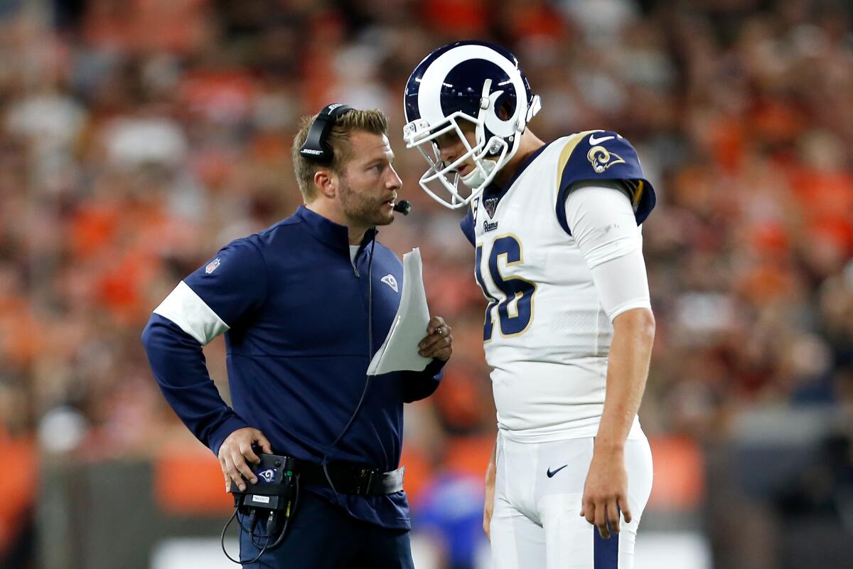 Rams coach Sean McVay talks with quarterback Jared Goff during a game against the Browns on Sept. 22 at FirstEnergy Stadium.