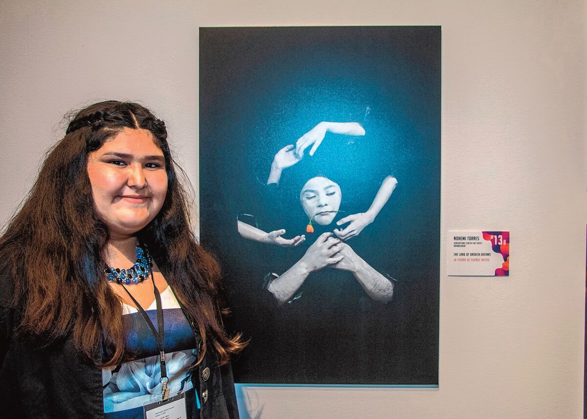 Nohemi Torres, 13, with her ‘Land of Broken Dreams' at Museum of Photographic Arts in Balboa Park, San Diego. She has been studying art for six years at the after-school Generations Center for Youth Advancement in City Heights.