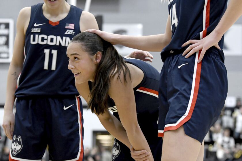 UConn's Nika Mühl takes a breather after falling to the court during the second half of an NCAA college basketball game against Providence, Wednesday, Feb. 1, 2023, in Providence, R.I. (AP Photo/Mark Stockwell)