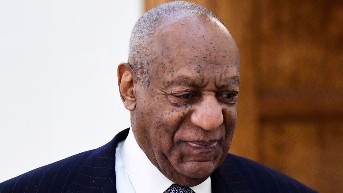 Entertainer Bill Cosby walks back to a courtroom April 4 after a break in his sexual assault trial at the Montgomery County Courthouse in Norristown, Pa.