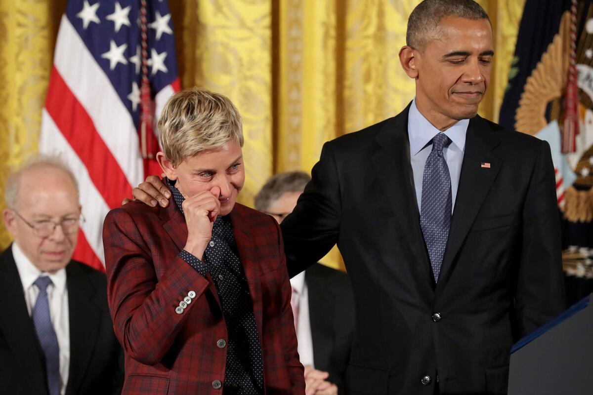 Ellen DeGeneres wipes away tears as her citation is read before being awarded the Presidential Medal of Freedom.