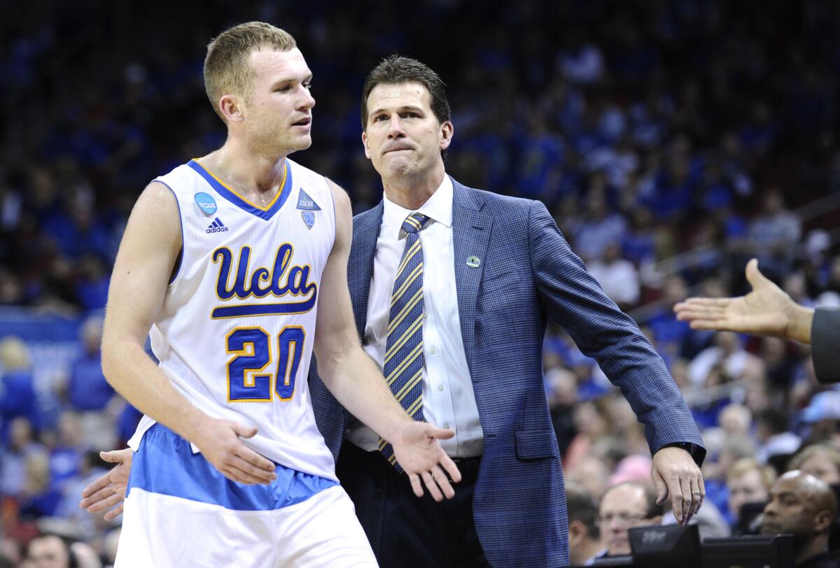 UCLA Coach Steve Alford congratulates his son Bryce as he comes off the court after a win over Alabama Birmingham in the third round of the NCAA tournament on March 21.