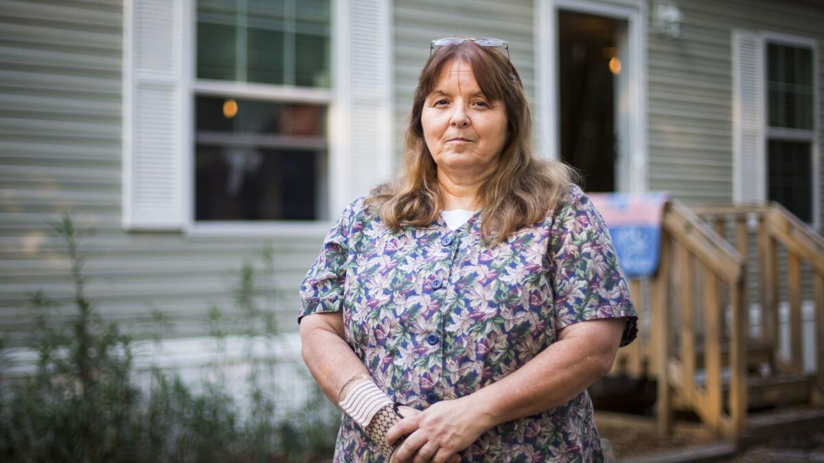 Kathy Watson outside her home in Lake City, Fla. The former business owner, who relies on the Affordable Care Act for health coverage, voted for Trump believing he wouldn't really repeal the healthcare law.