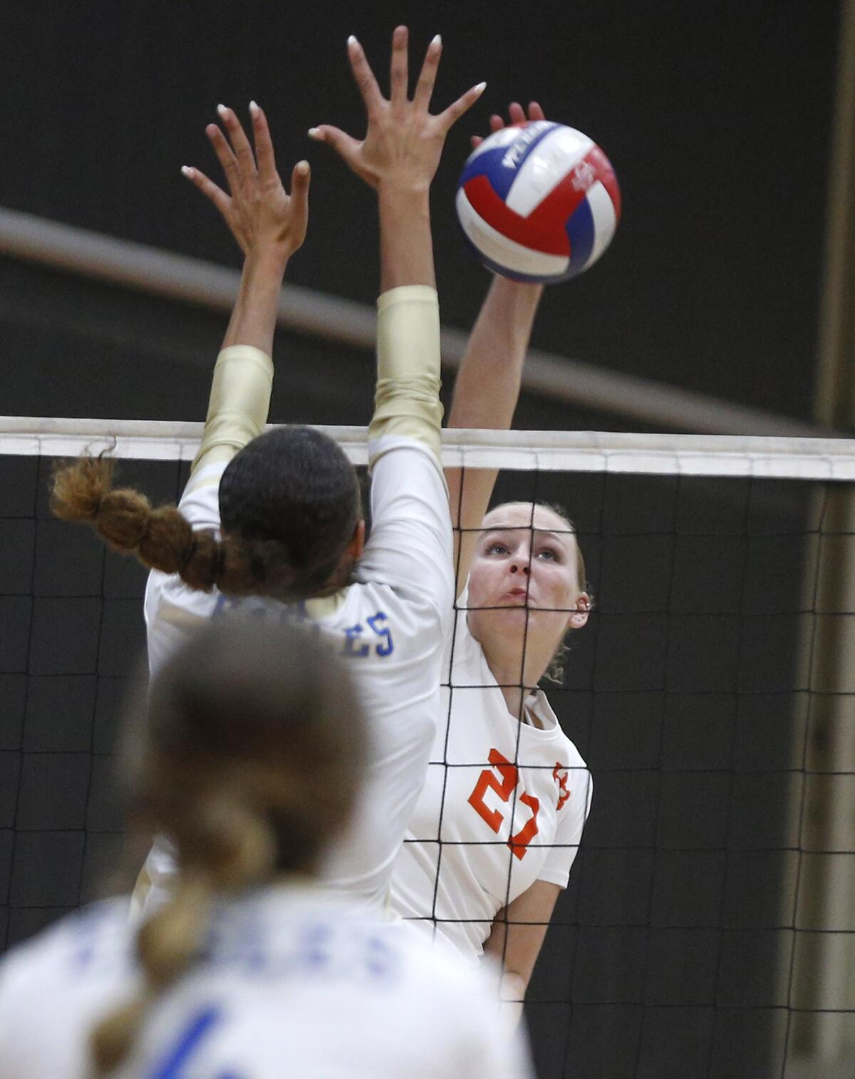 Huntington Beach opposite Taylor Ponchak (27) kills a ball against Santa Margarita on Tuesday.