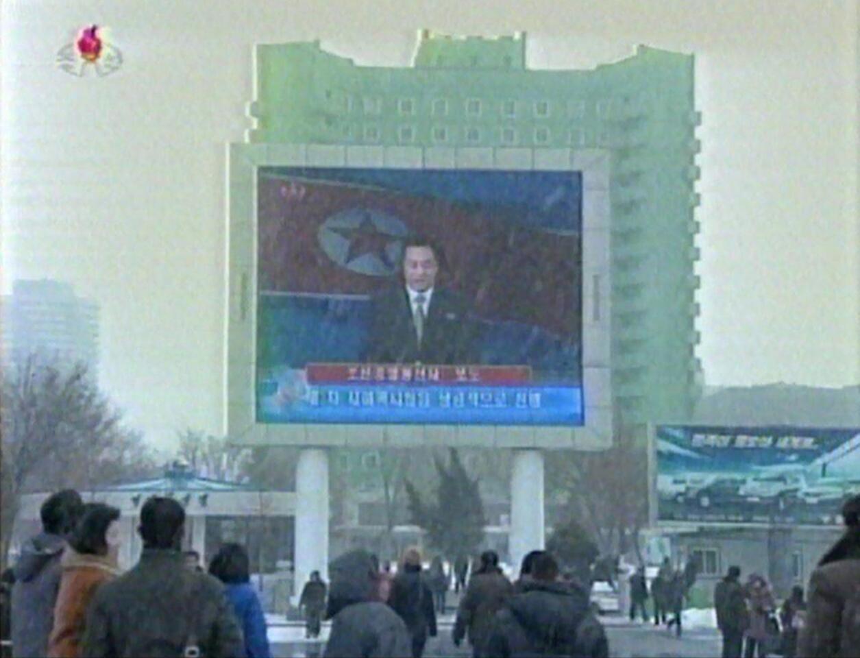 North Koreans watch an announcer reading a statement on the country's nuclear test on a large screen in front of Pyongyang's railway station. A defiant North Korea on Tuesday staged its most powerful nuclear test yet and warned of "stronger" action to follow if the ensuing wave of global condemnation translated into tougher sanctions.