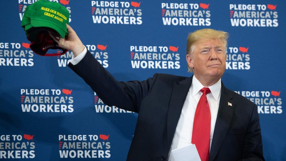 Trump with "Make Our Farmers Great Again" hats