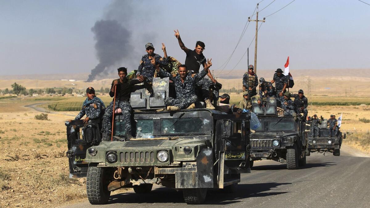 Iraqi government forces enter an oil field west of Kirkuk.