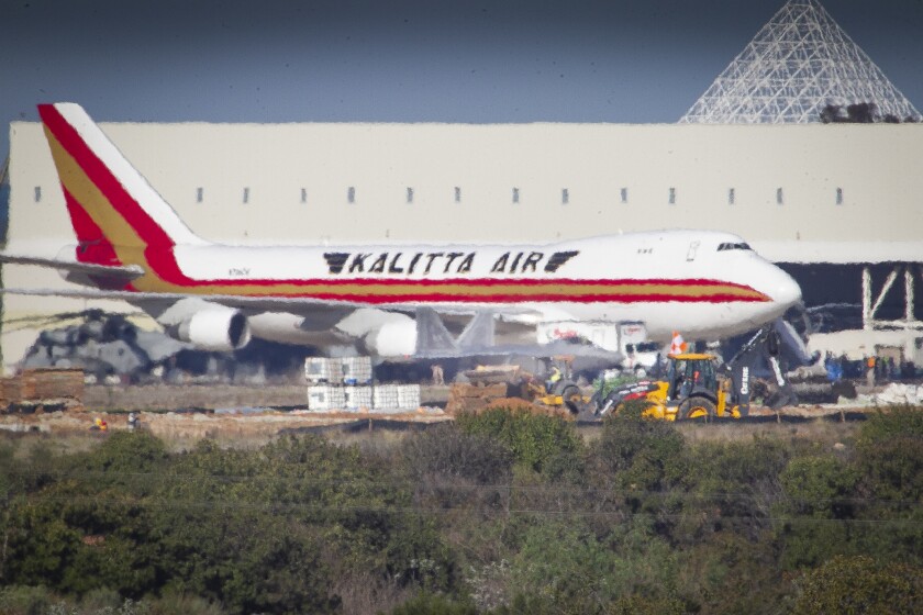 The second flight of U.S. citizens fleeing the coronavirus in China to arrive at MCAS Miramar aboard a Kalitta Air Boeing 747, is unloaded after landing, February 7, 2020 in San Diego, California.