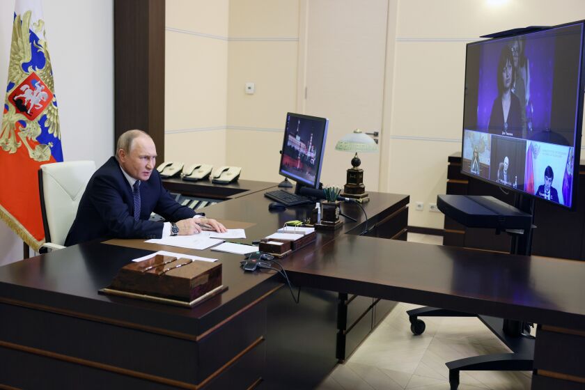 Russian President Vladimir Putin speaks during a meeting with the winners and finalists of the School Teacher of the Year national contest via videoconference at the Novo-Ogaryovo residence outside Moscow, Russia, Wednesday, Oct. 5, 2022. (Gavriil Grigorov, Sputnik, Kremlin Pool Photo via AP)