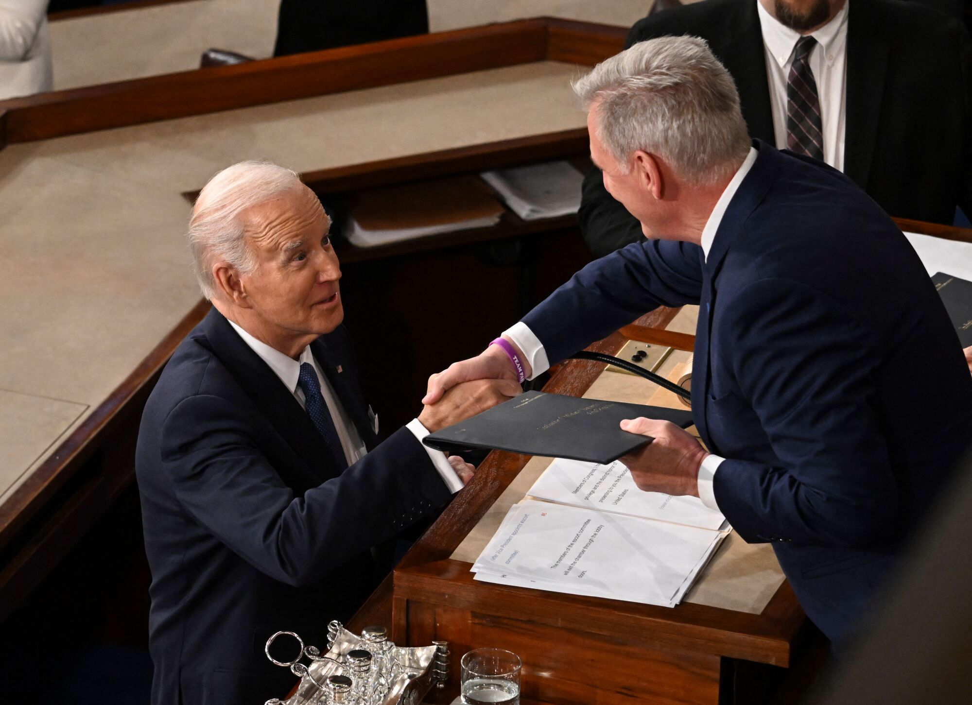 Speaker of the House Kevin McCarthy (R), (R-CA), shakes hands with US President Joe Biden