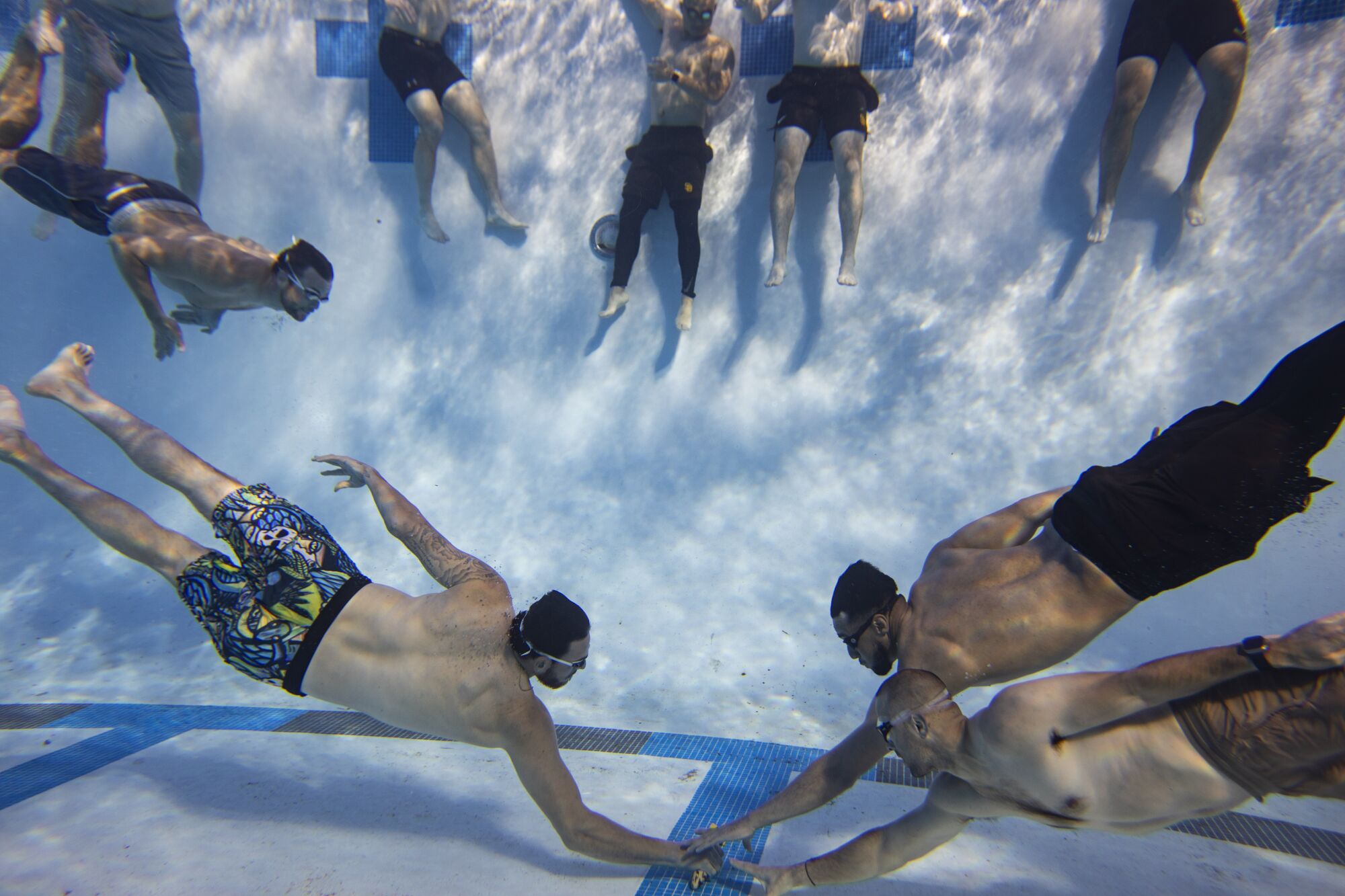 Joe Musgrove, left bottom, beats Padres teammates to the torpedo in an Underwater Torpedo game.