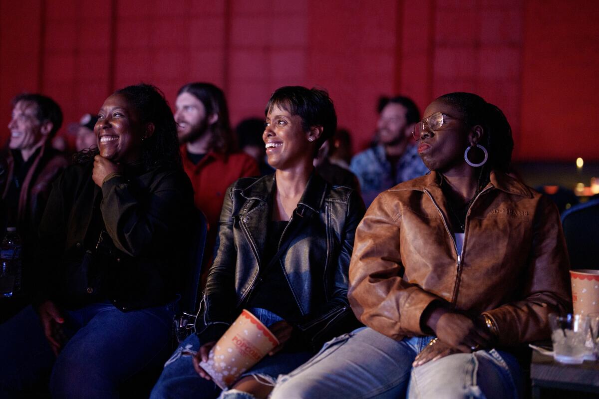 Audience members respond astatine the Upstairs Comedy Club