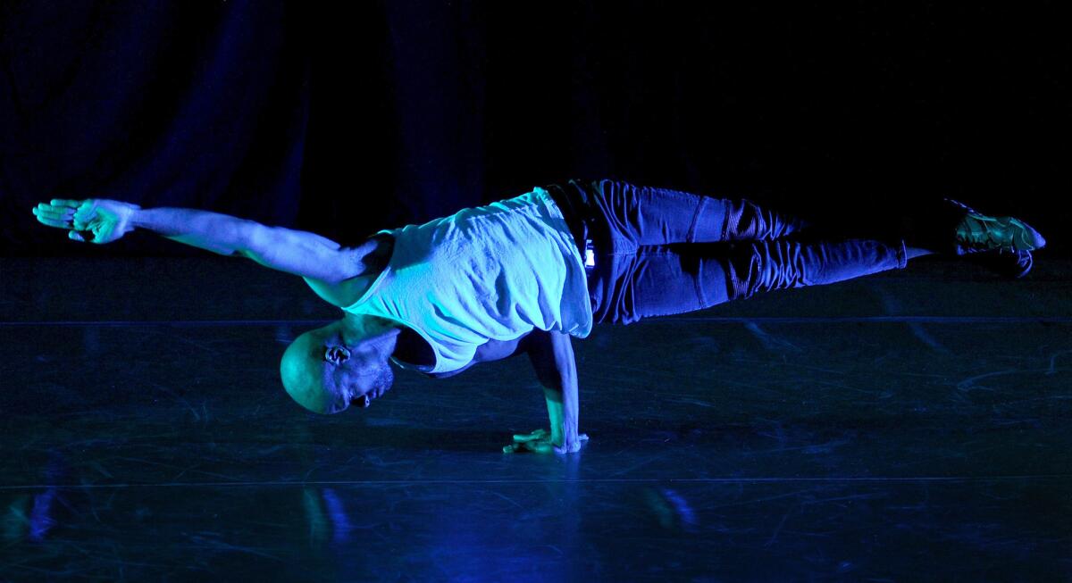 Lamonte "Tales" Goode balances on one hand during the Friday performance of "In a Room on Broad St." is Los Angeles.