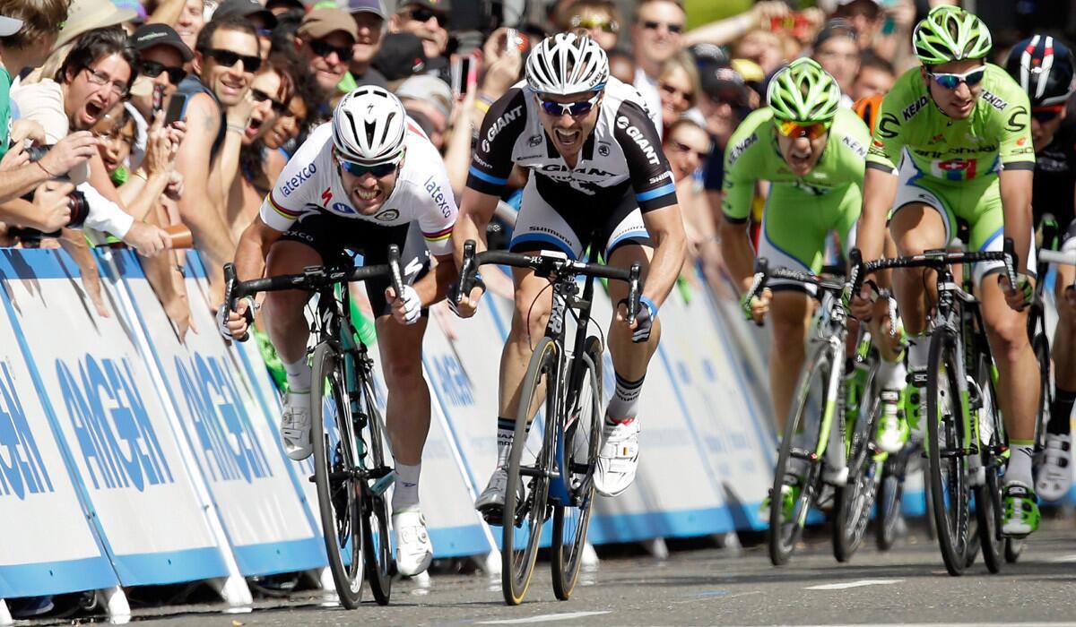 Mark Cavendish, left, edges ahead of John Degenkolb to win the first stage of the 2014 Amgen Tour of California on Sunday in Sacramento.