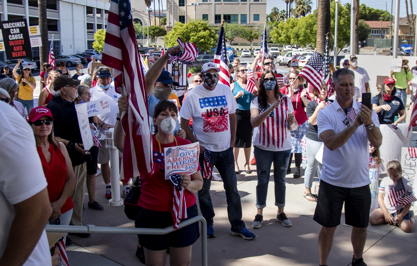 RIVERSIDE, CALIFORNIA - MAY 5, 2020: Protesters who want the public health orders rescinded, rally at the County Administrative Center where the Riverside County Board of Supervisors are meeting in the midst of the ongoing coronavirus pandemic on May 5, 2020 in Riverside, California. (Gina Ferazzi/Los Angeles Times)