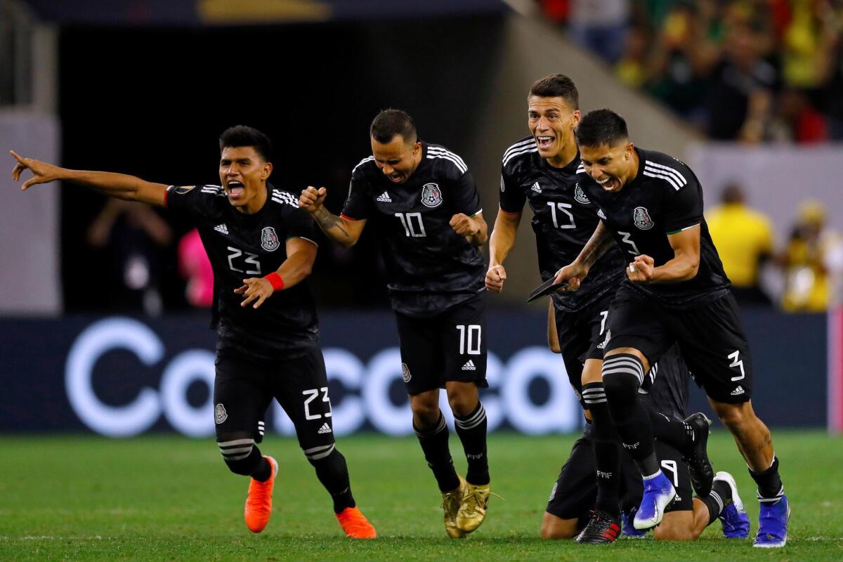 Mexico's players celebrate after winning the CONCACAF Gold Cup Quarterfinal football match against Costa Rica after penalty kicks on June 29, 2019 at NRG Stadium in Houston, Texas.