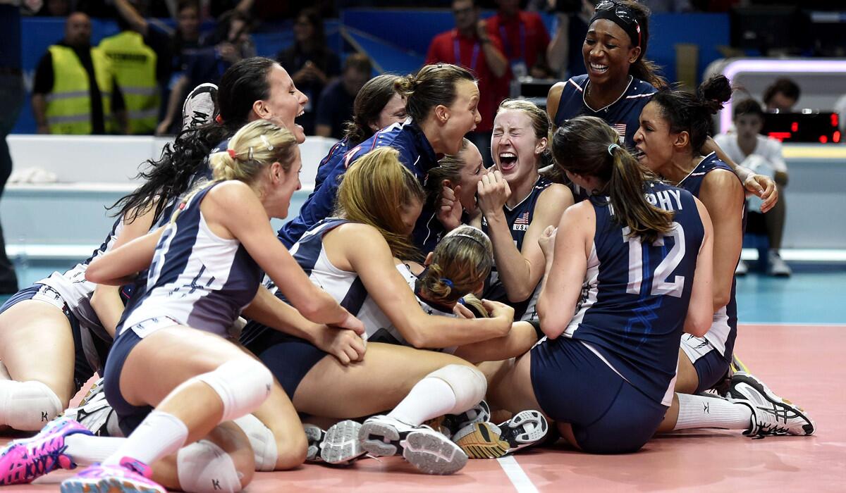 U.S. women's volleyball players celebrate after China for the world title on Sunday in Milan.