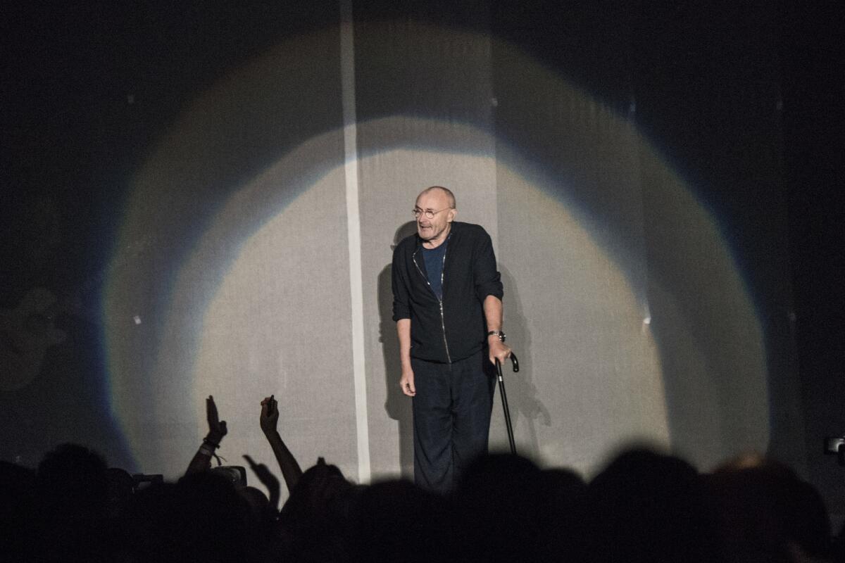 Phil Collins came onstage using a cane.
