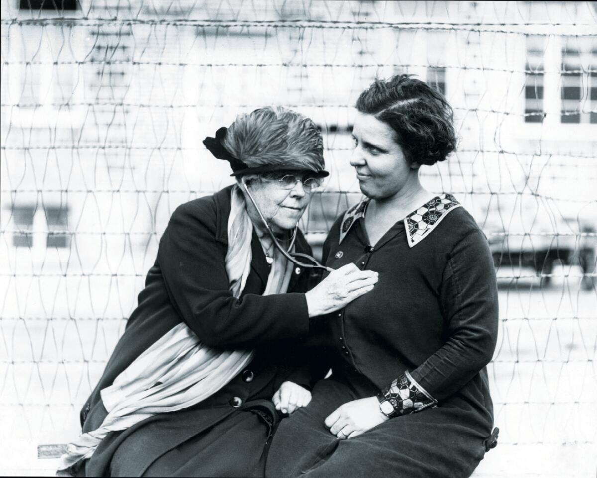 Dr. Charlotte Baker uses a stethoscope on Mrs. R.M. Moran on Dec. 18, 1925.