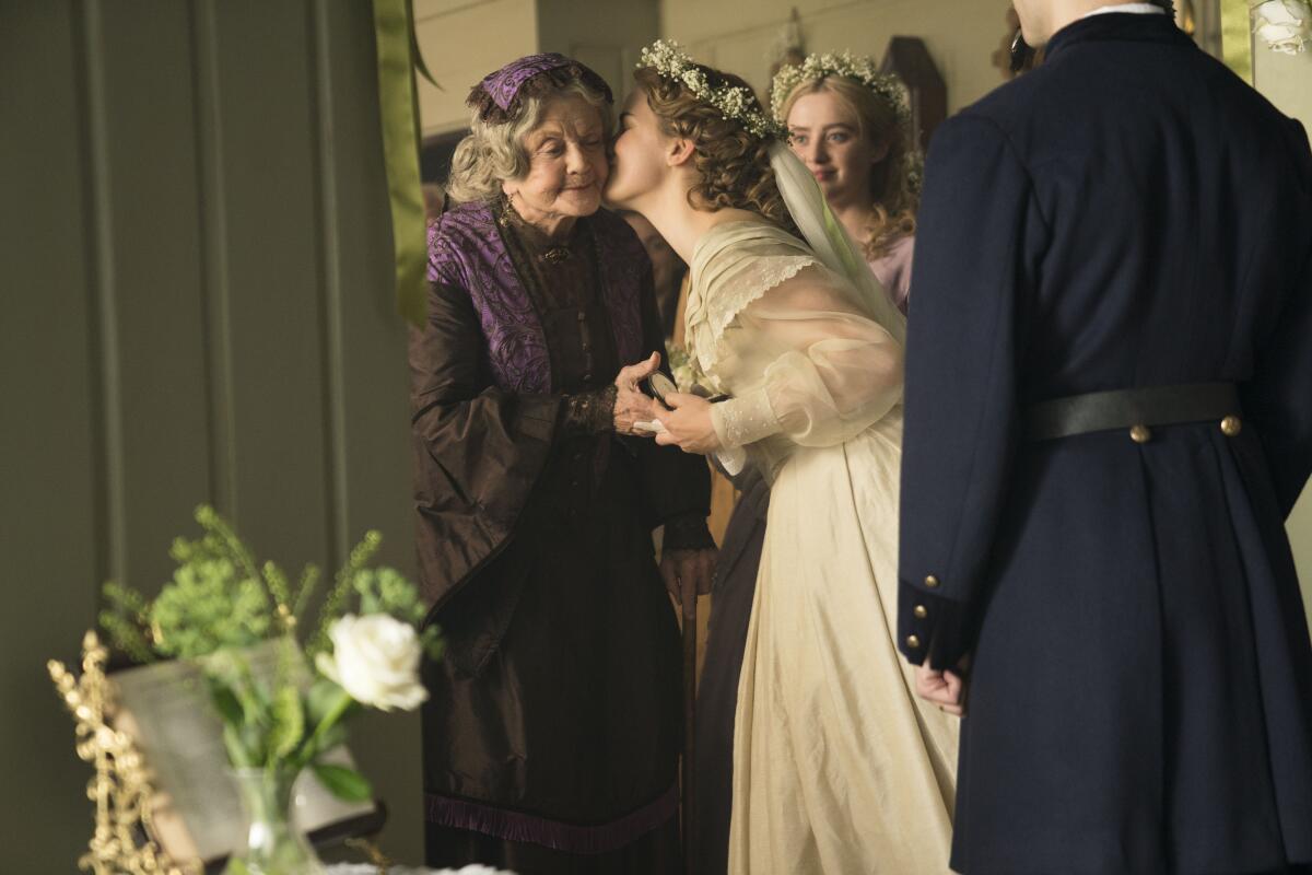 Angela Lansbury, left, is kissed on the cheek by Willa Fitzgerald in the TV miniseries ”Little Women.”  