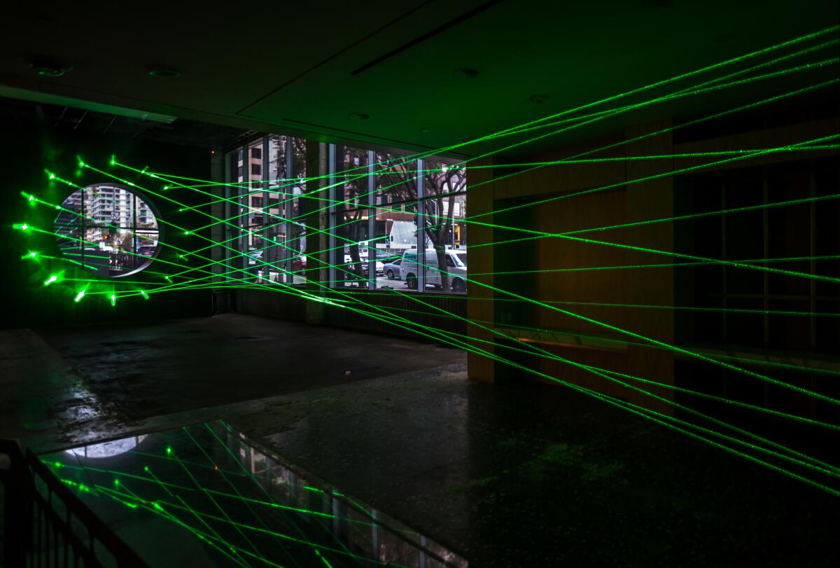 A laser installation is shown inside a room.