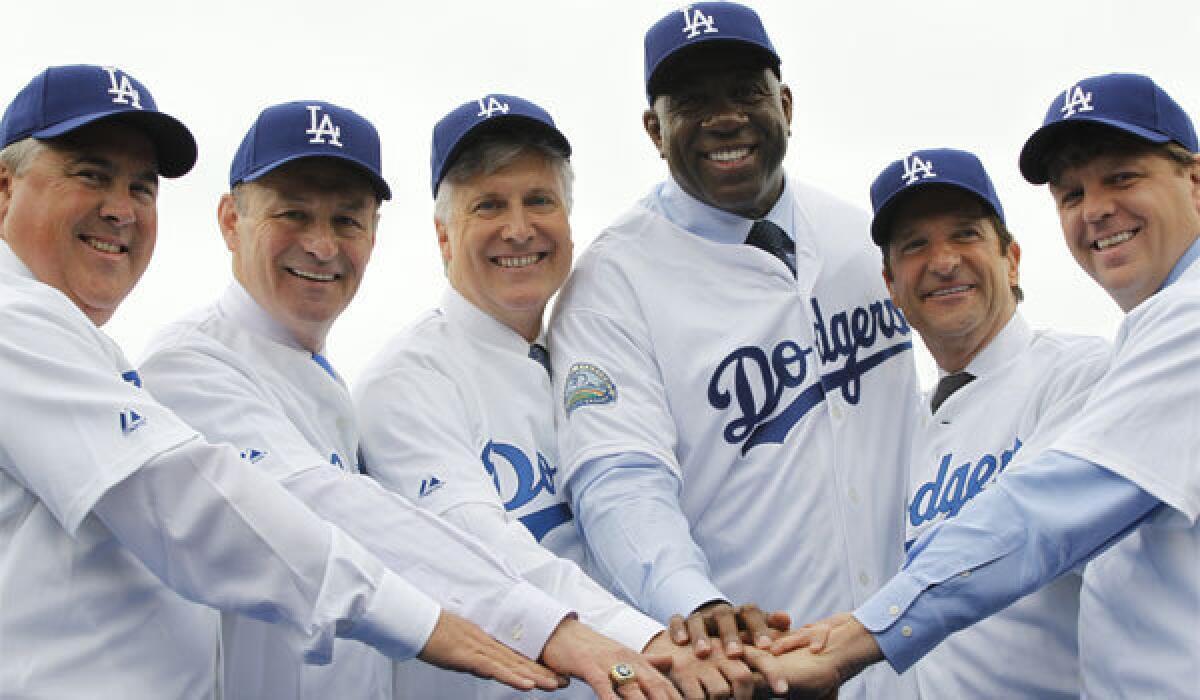 The Guggenheim group is introduced at a news conference in center field at Dodger Stadium in May 2012.