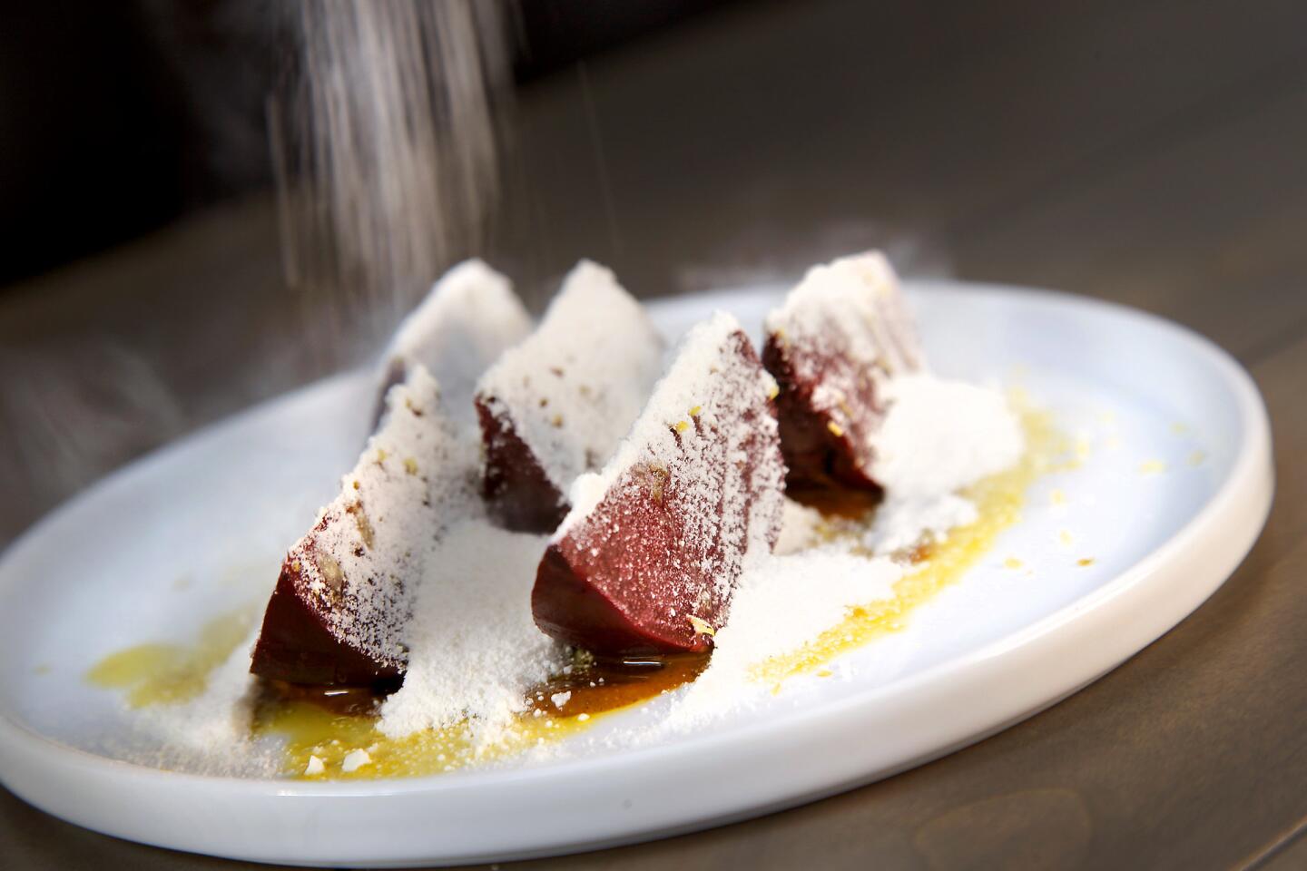 Michael Voltaggio's latest restaurant project is Ink.well, a reboot of his last restaurant, Ink, in a new space with a pretty new menu. Pictured here are the Beets by Michael dish, with pistachio butter and horseradish goat cheese.