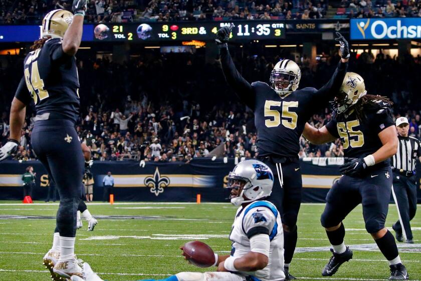 New Orleans Saints linebacker Jonathan Freeny (55) celebrates his sack of Carolina Panthers quarterback Cam Newton (1) on a third down, forcing the Panthers to kick a field goal, in the second half of an NFL football game in New Orleans, Sunday, Jan. 7, 2018. (AP Photo/Butch Dill)