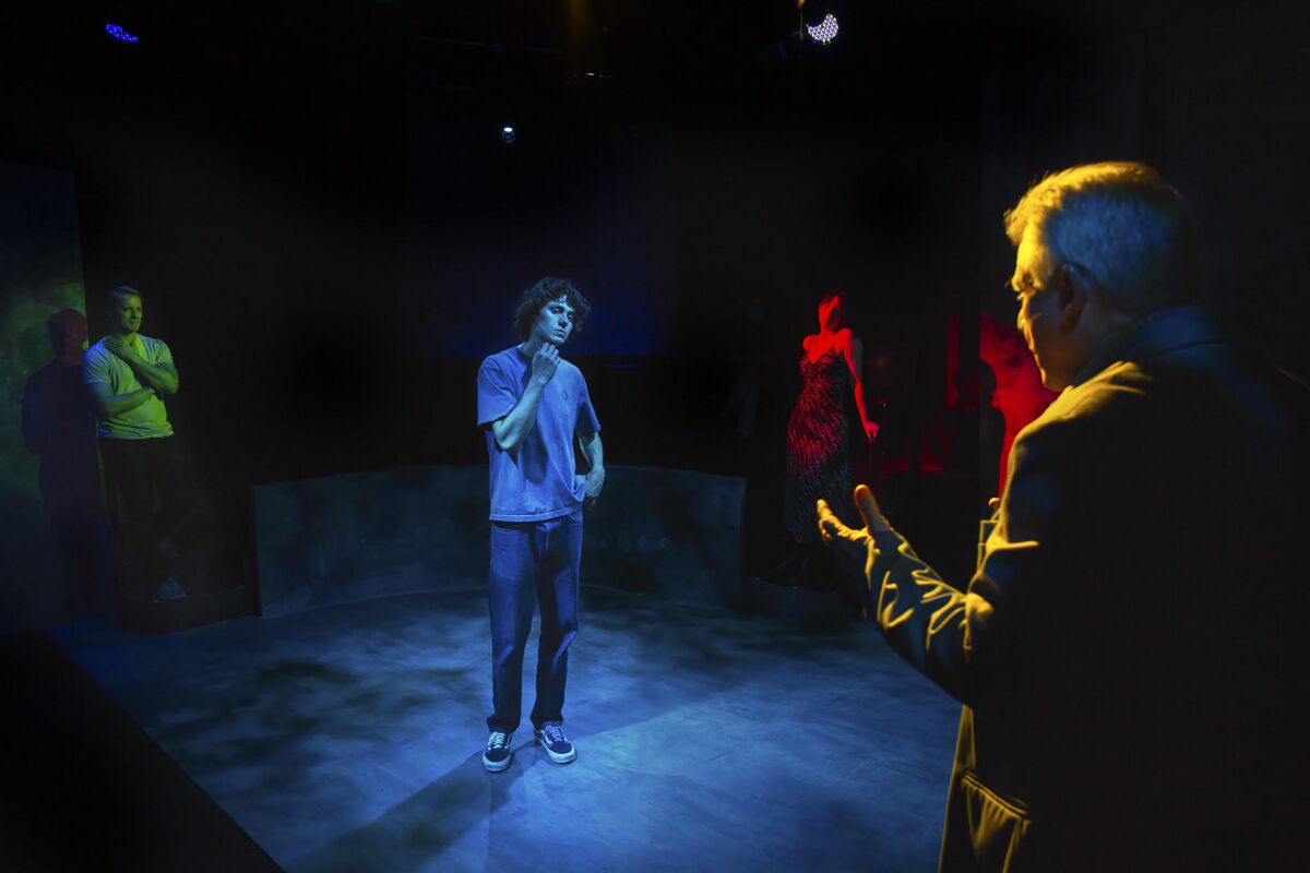 A performer in a blue spotlight.