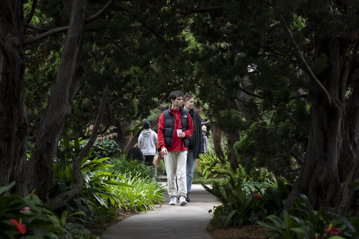 Ethan Cohen, 26, left, and Cheyenne Blaisdell, 26, at the Meditation Gardens at Self-Realization Fellowship in Encinitas.