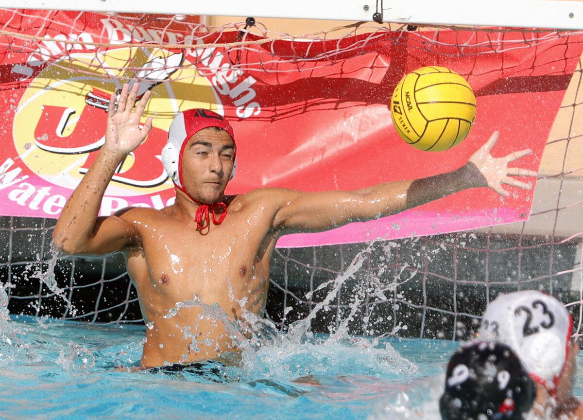 Glendale's Ronald George saves a Burroughs shot on goal in a Pacific League boys' water polo match at Burroughs High School on October 1, 2019. Glendale won the match 10-8.