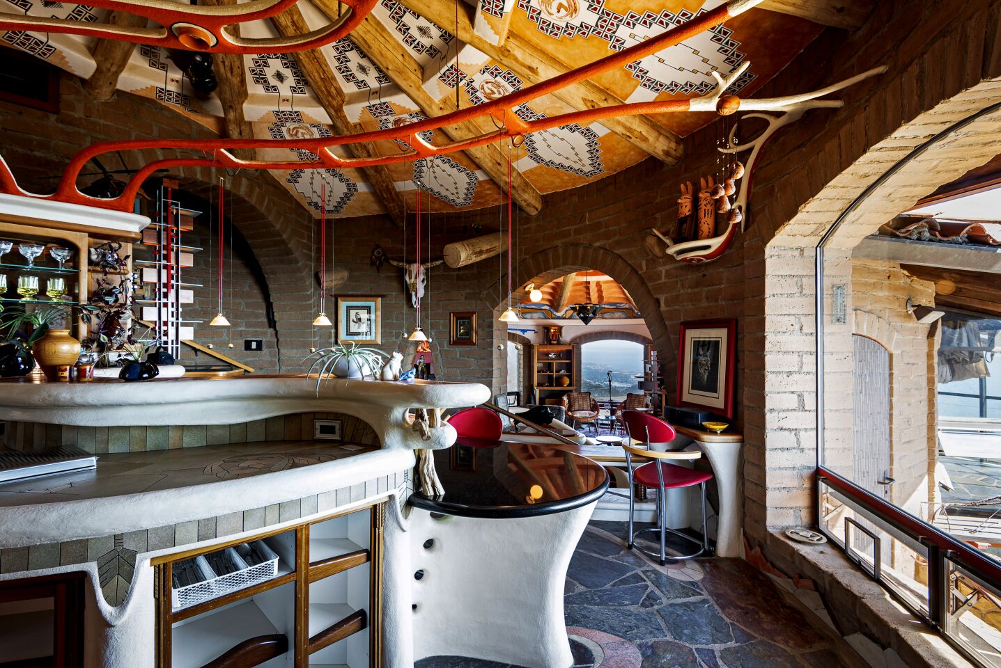 The rounded rooms, built with adobe brick, are themed for the five natural elements (water, fire, earth, wood and air).