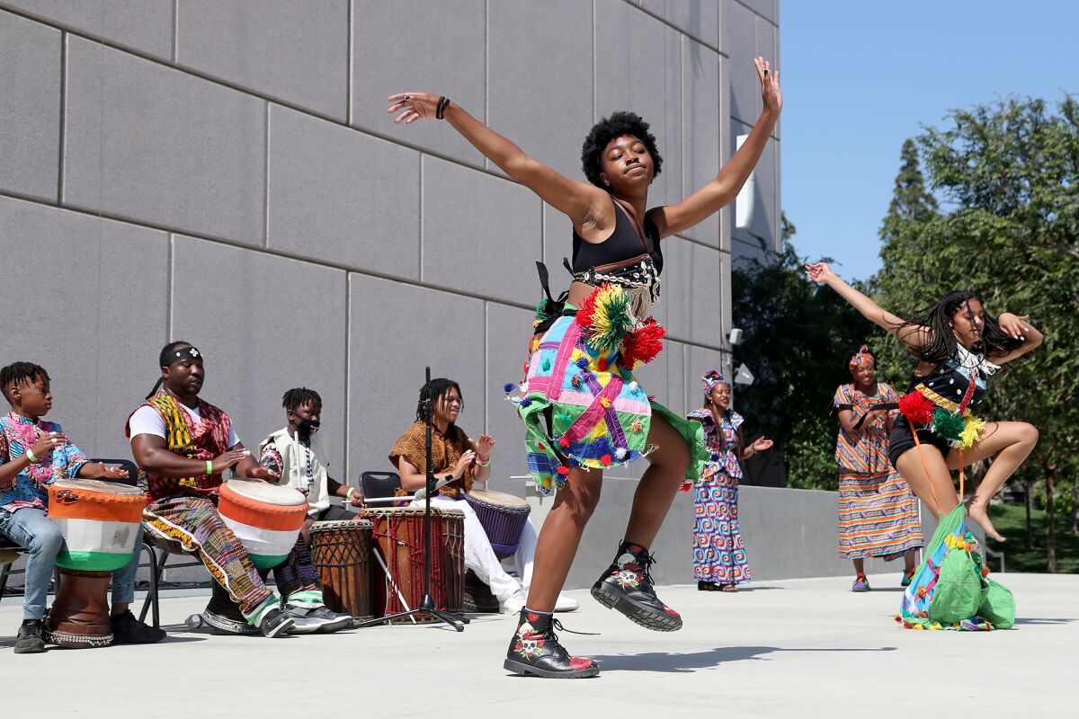 Members of the Dembrebrah Drum and Dance Ensemble perform during "Freedom in Full Bloom: a Juneteenth Celebration." 