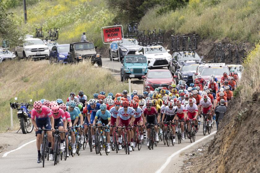 20190514. The Education First team with Taylor Phinney setting the pace, leads the peloton, followed by all the team cars, up Patterson Pass for the Amgen Tour of California Tuesday May 14.