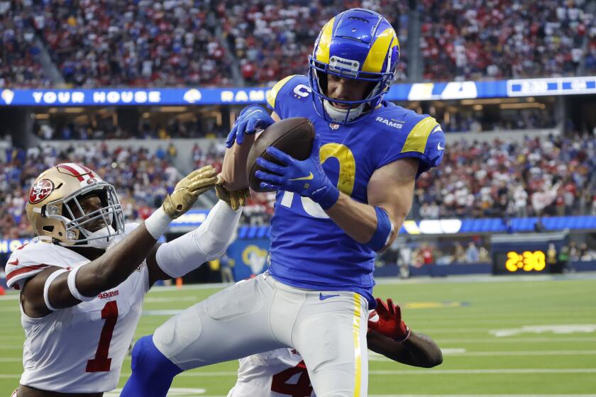 INGLEWOOD, CA - JANUARY 9, 2022: Los Angeles Rams wide receiver Cooper Kupp (10) catches a touchdown pass.