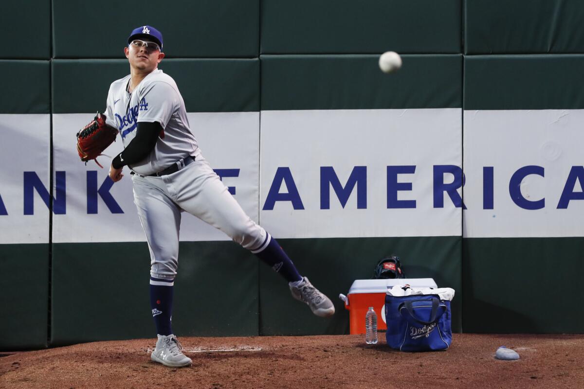 Dodgers pitcher Julio Urias warms up in the bullpen during the second inning in Game 5 of the National League Division Series