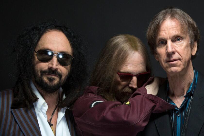 Guitarist Mike Campbell, left, shown with Mudcrutch bandmates Tom Petty and Tom Leadon, bought an investment property from fellow musician Scott Thurston for $1.29 million.