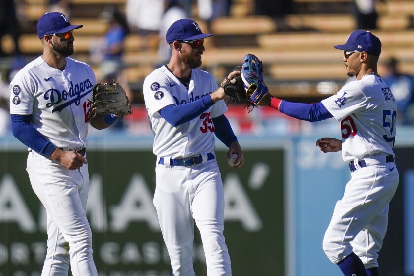 From left to right, Los Angeles Dodgers' Joey Gallo, Cody Bellinger and Mookie Betts.