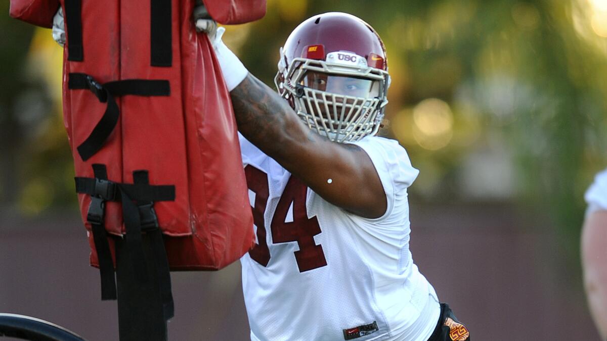 USC defensive lineman Leonard Williams takes part in drills during an Aug. 4 practice. Williams is happy to be back at practice after missing most of last week's sessions because of injury.