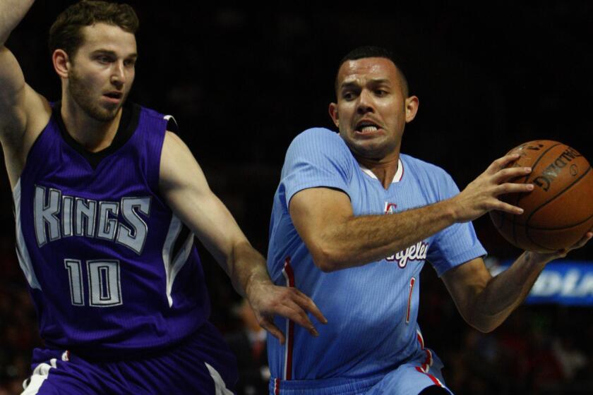 Clippers guard Jordan Farmar, right, tries to drive past Sacramento Kings guard Nik Stauskas during the Clippers' 98-92 loss at Staples Center on Nov. 2.