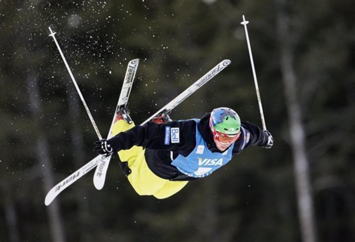 Canada's Alexandre Bilodeau takes to the air during practice for the men's qualifying for the World Cup freestyle moguls at Deer Valley Resort, Saturday, Jan. 16, 2010, in Park City, Utah. (AP Photo/Colin E Braley)