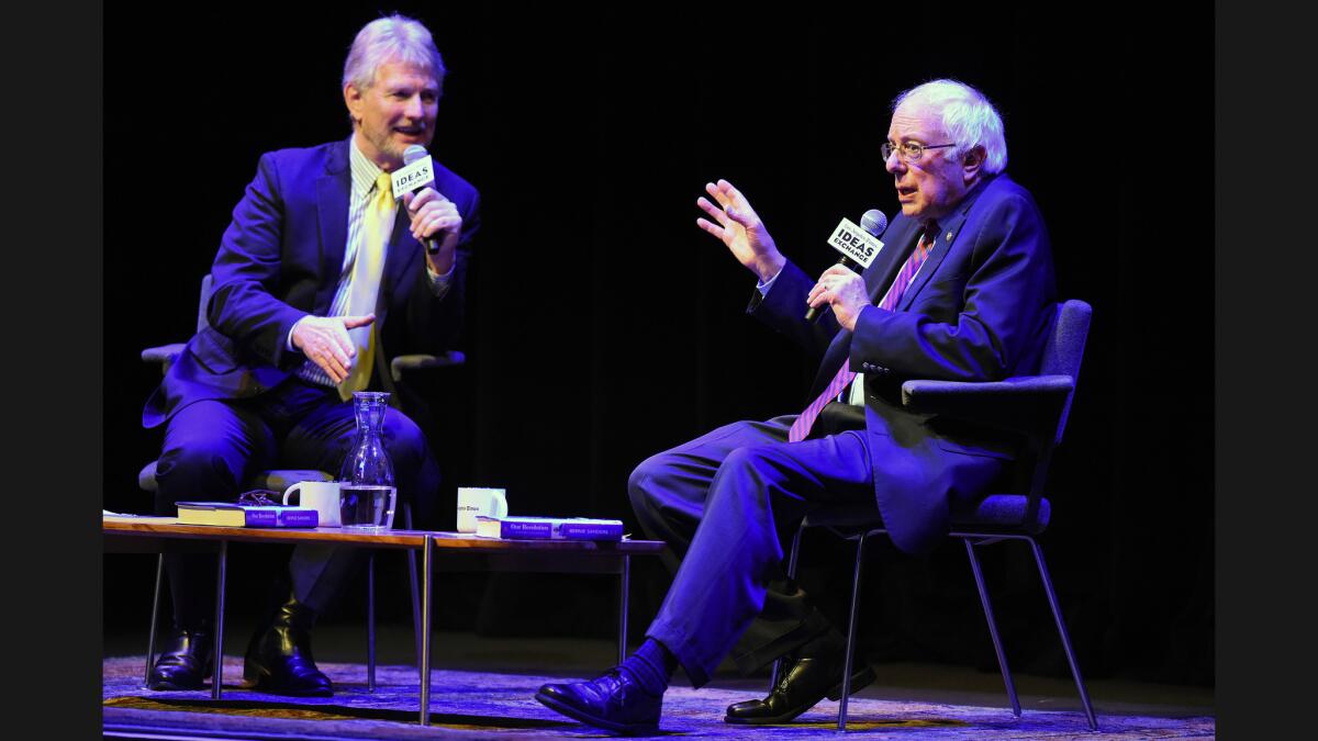 Sen. Bernie Sanders, right, is interviewed by Times political cartoonist David Horsey at the Theatre at Ace Hotel over the weekend.