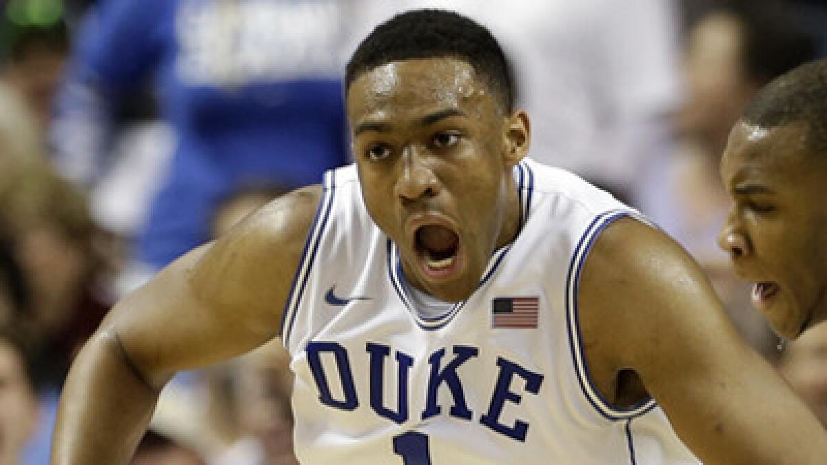 Duke's Jabari Parker, left, celebrates alongside teammate Rasheed Sulaimon after scoring a basket against North Carolina State in the ACC tournament semifinals Saturday. Parker could be the first overall pick of the 2014 NBA draft.