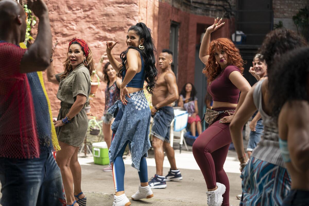 A group of women dancing in the street.