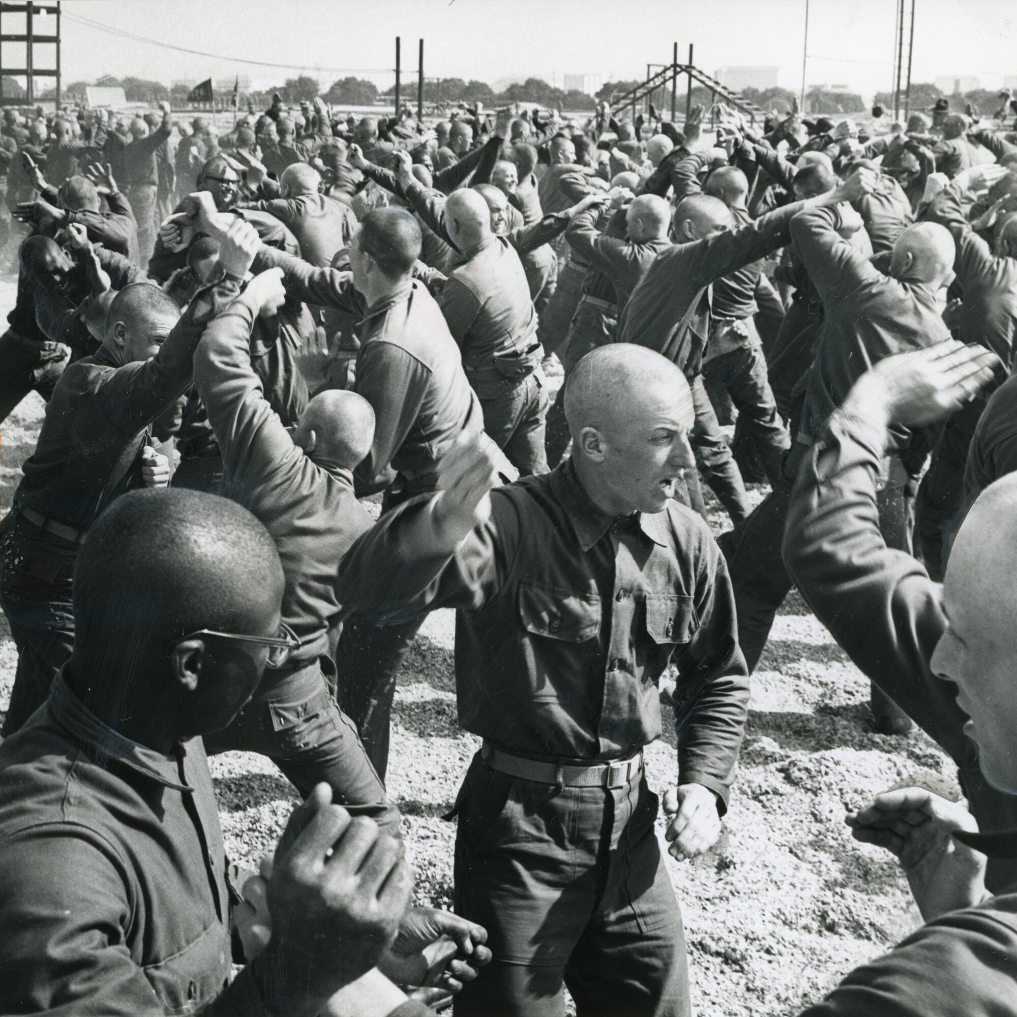 Shaved-head recruits learn hand-to-hand combat at the Marine Corps Recruit Depot in San Diego 