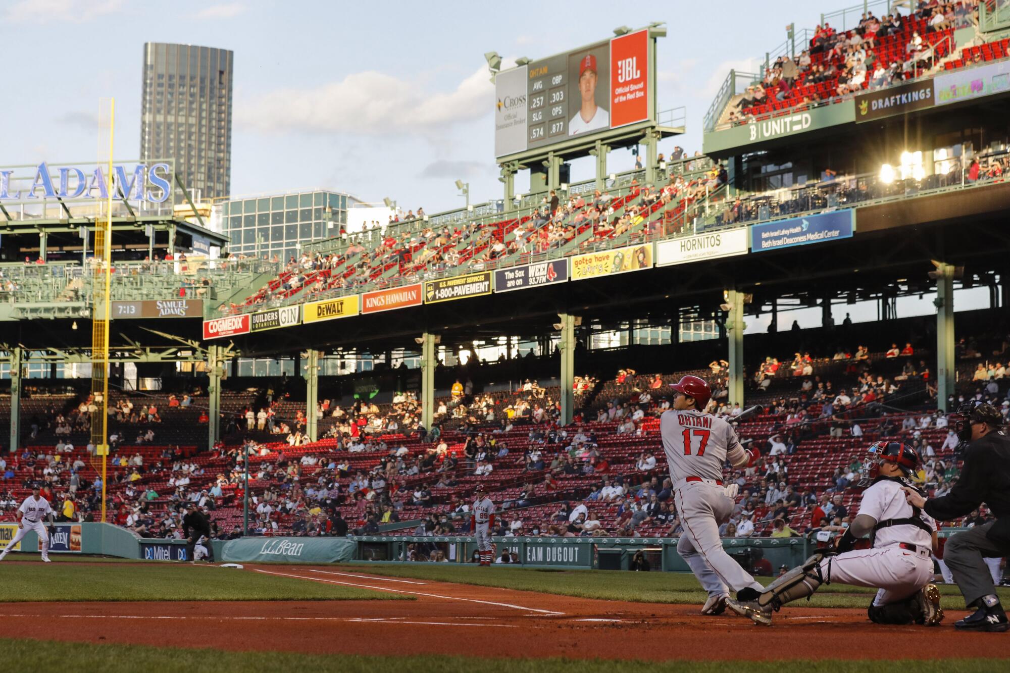 Angels designated hitter Shohei Ohtani follows through on a double against the Boston Red Sox on May 14.