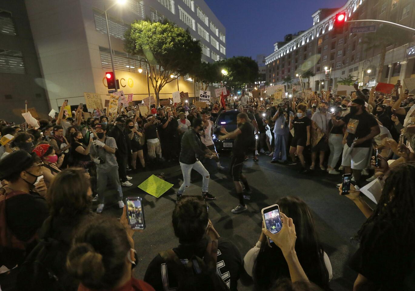 Protesters dance on Spring Street in downtown Los Angeles