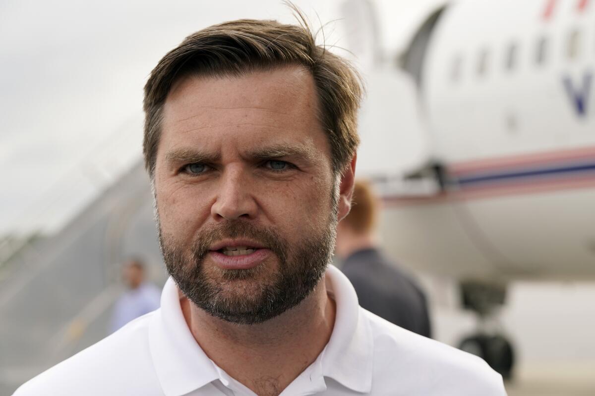 Republican vice presidential nominee Sen. JD Vance in a white shirt